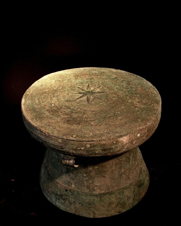 A well cast and intricately decorated bronze drum from the Dong Son culture, circa 4th - 3rd century BC, Red River Delta, Vietnam. 

The face of the drum features a central 8 pointed star surrounded by bands of alternating geometric designs. A