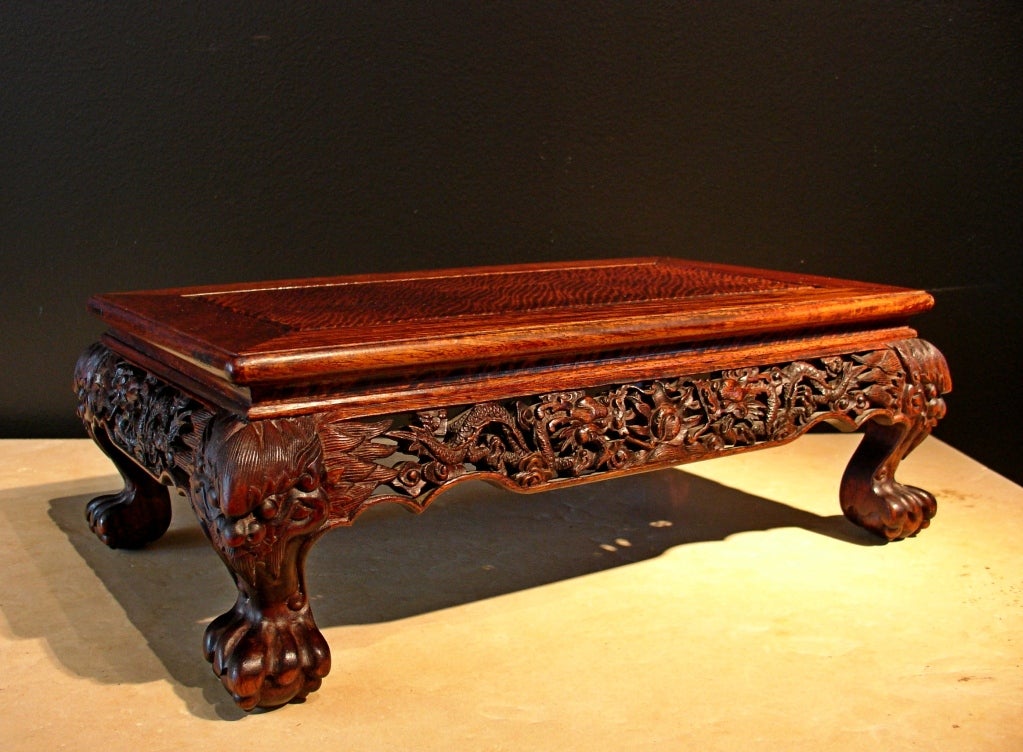 An exquisite late Qing dynasty display Stand of longyan wood, carved as a miniature 
