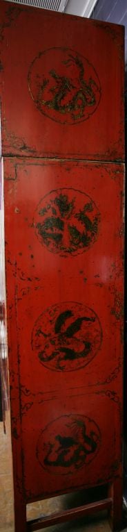 A Chinese Red Lacquer Compound Cabinet with Gilt Dragons