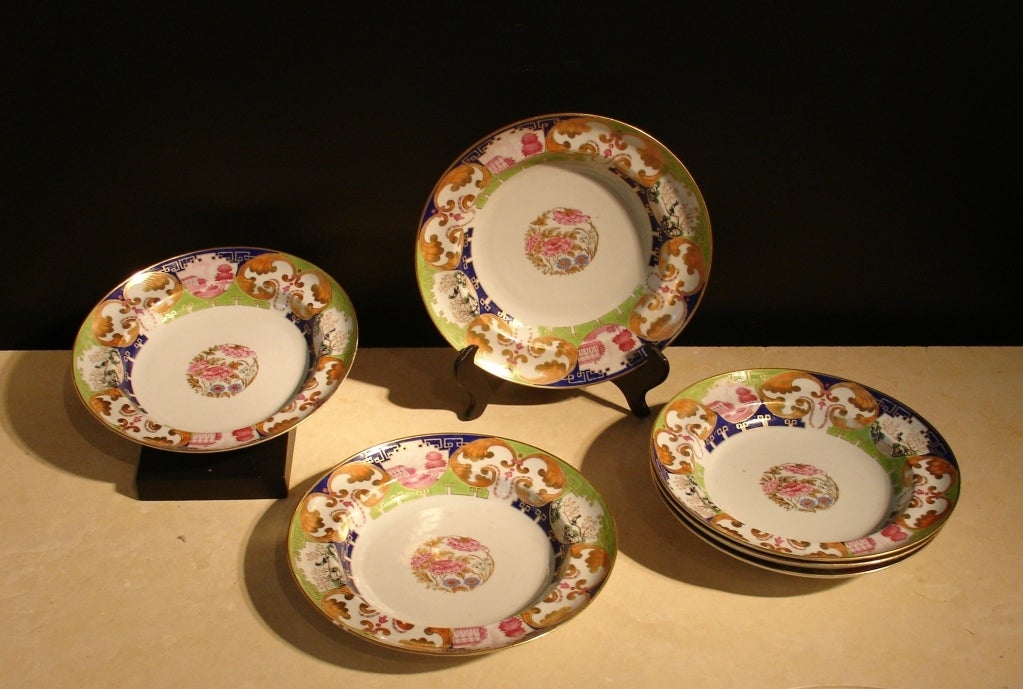 A set of six porcelain soup dishes decorated with a modified 