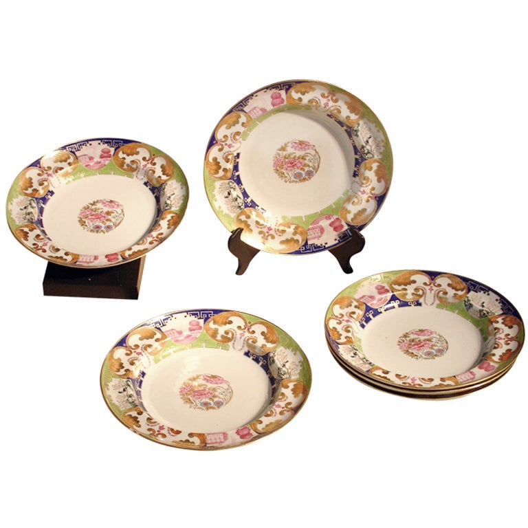 A Set of Six  Famille Rose "Pompadour" Soup Plates