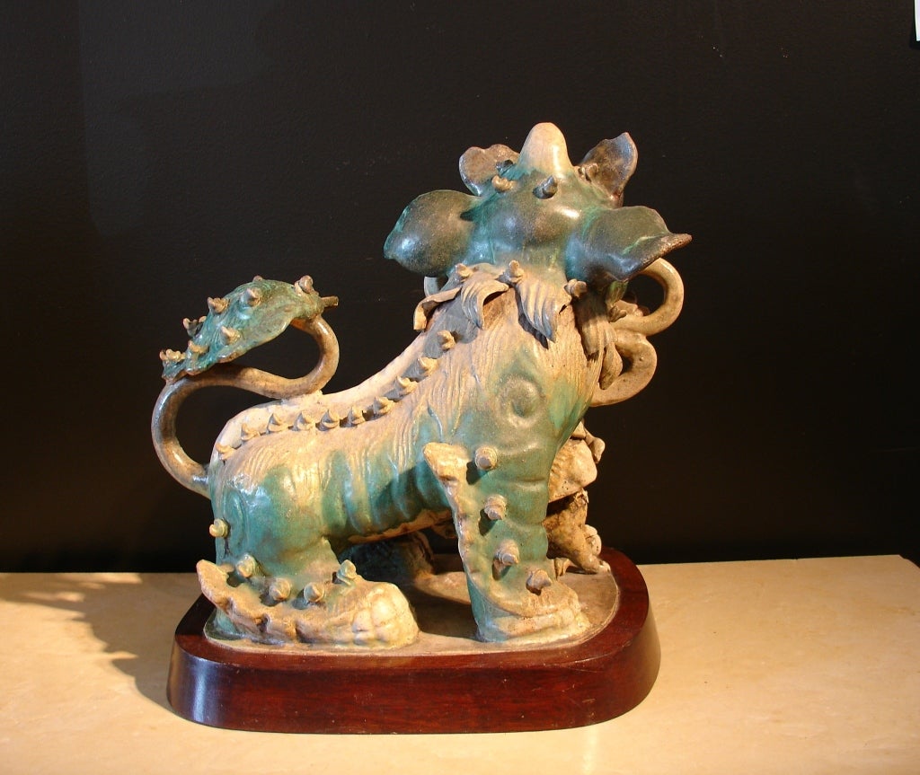 18th Century and Earlier A Chinese Glazed Shiwan Pottery Foo Dog