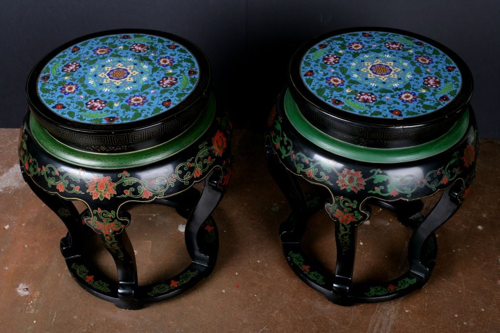 A charming and unusual Chinese lacquered and painted stool with cloisonne inset top. The delicate floral motifs of the cloisonne are echoed in the painting over the lacquer. Can also be used as a side or end table.<br />
<br />
Only one available