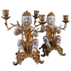 Pair of Chinoiserie Figural Porcelain and Ormolu Two-Arm Candelabra