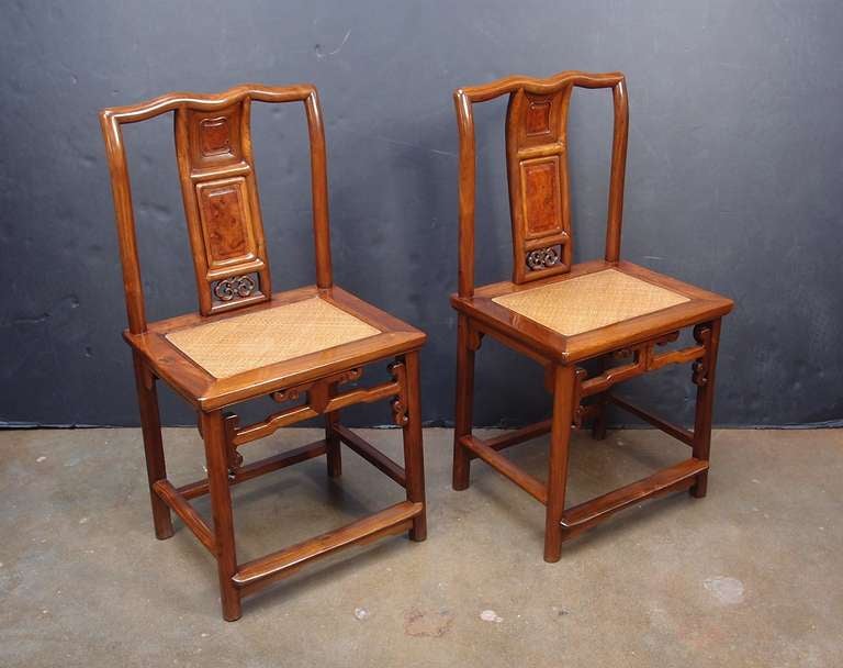 A wonderful pair of Chinese huanghuali and huamu (burlwood) inset nanguanmaoyi (southern official's chair). 

Straight lines and gentle curves work in delicate harmony to please both the eye and the body. The crest rail has an elegant and unusual