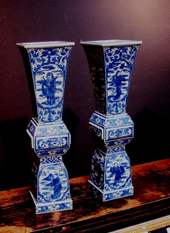 A Pair of Chinese Blue and White Temple Candlesticks or Vases