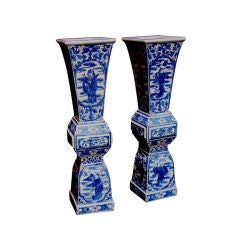 A Pair of Chinese Blue and White Temple Candlesticks or Vases