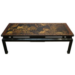 A Chinoiserie Black Lacquer and Gilt Decorated Coffee Table
