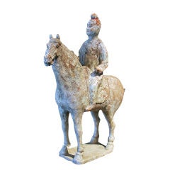 A Tang Dynasty Pottery Model of a Horse and Noble Rider