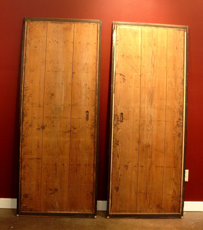 A pair of Japanese sliding doors or shutters, for use in a household or a tea house. Elegantly simple and subdued, with minimal detailing and clean lines throughout.<br />
<br />
Amado are the exterior component of the more well known shoji doors,