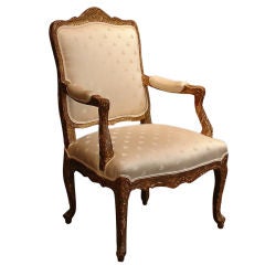 A French Louis XV Giltwood Armchair