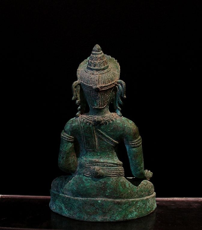 A Khmer-Lopburi Bronze Figure of an Adonrned Buddha In Excellent Condition In Austin, TX