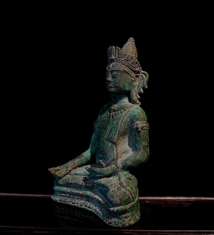 18th Century and Earlier A Khmer-Lopburi Bronze Figure of an Adonrned Buddha