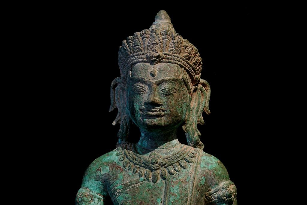 A Khmer-Lopburi Bronze Figure of an Adonrned Buddha 1