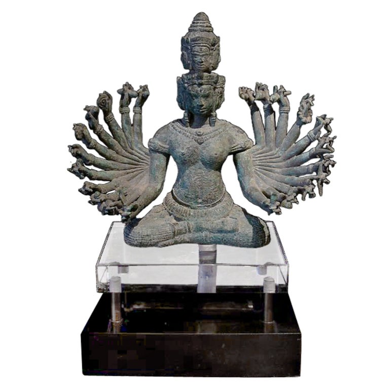 The embodiment of transcendental wisdom, Prajnaparamita is often referred to as the mother of all Buddhas. 

In this extremely rare tantric form, she is portrayed seated in the half lotus position. Her eleven faces are arranged in two tiers (seven