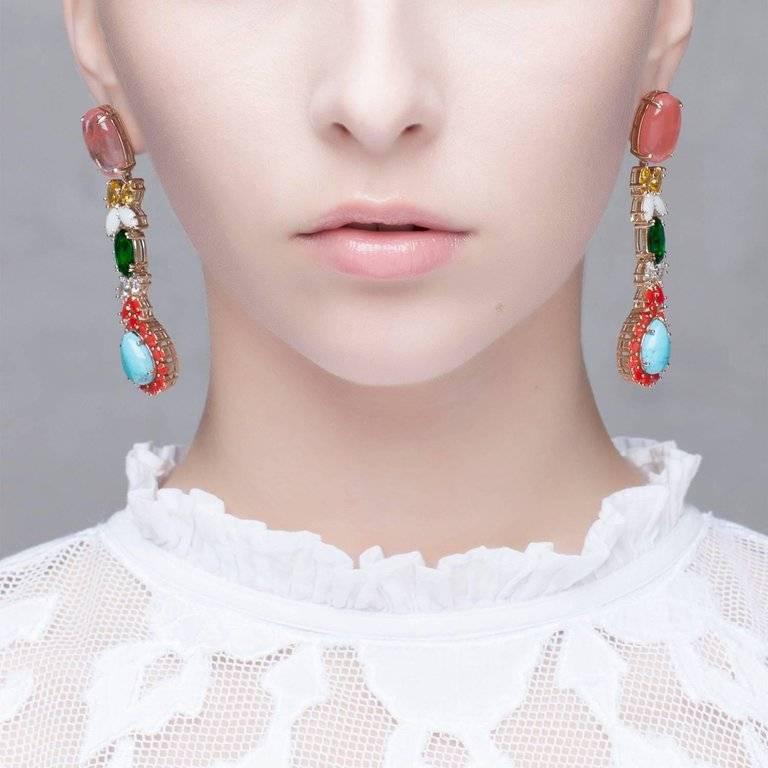 Inject a dose of color with these watermelon agate dangling earrings. Following the vocation of the brand, this pair of earrings translate colors and shapes into eclectic jewels, featuring a cascade of multicolor zircons. Handmade jewel dedicated to