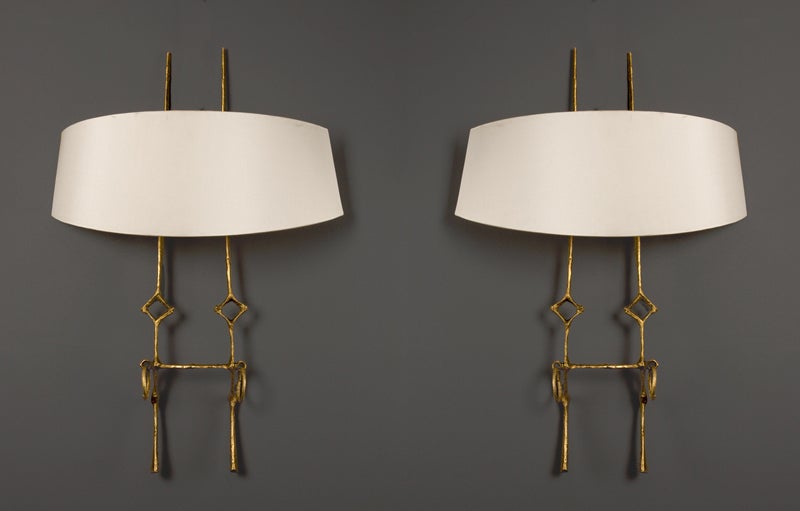 A pair of gilt bronze wall lights with shades, 1961
'Chimene'