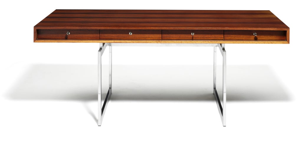 A rosewood desk designed by Bodil Kjaer, manufactured by E Perterson & Son