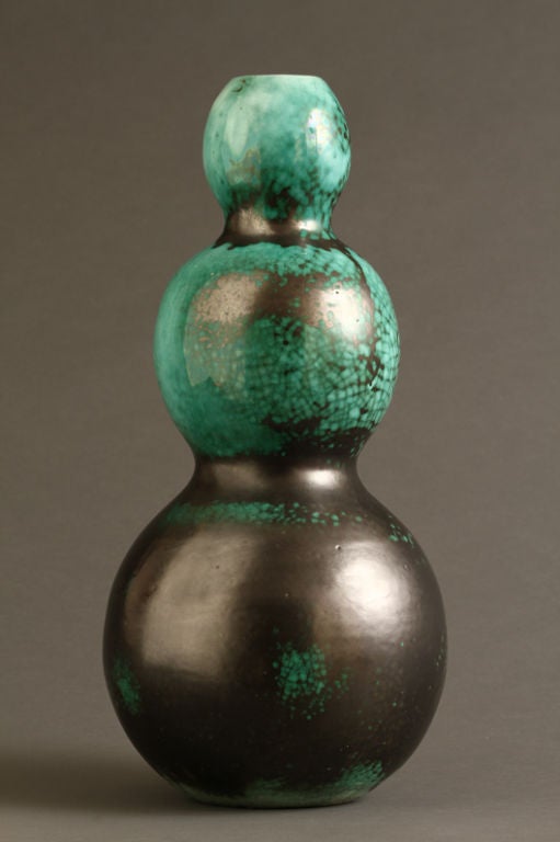 A ceramic vase signed at the base.