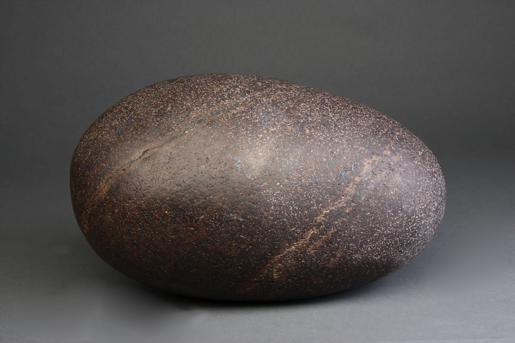 A beautiful exemplar of a Chinese Scholars' Rock.

As far back as the Han Dynasty (200bc-200ad) we can see examples of rocks decorating gardens and courtyards. Scholars' Rocks are smaller, no more than five or six feet tall that were taken indoors