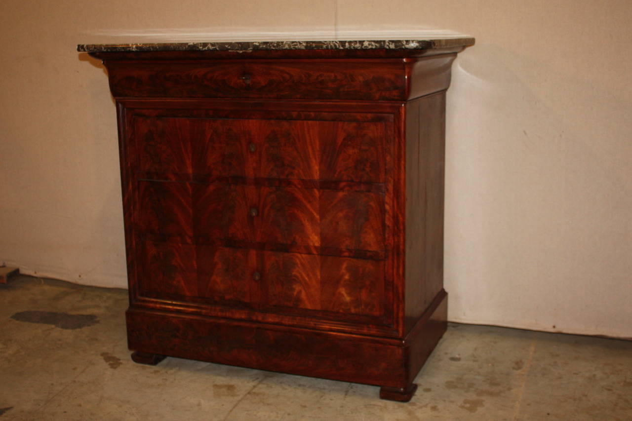 This is a nice small Louis Philippe marble top commode dating to the late 1800's.  The commode is mahogany.  It has four drawers, all dovetailed.