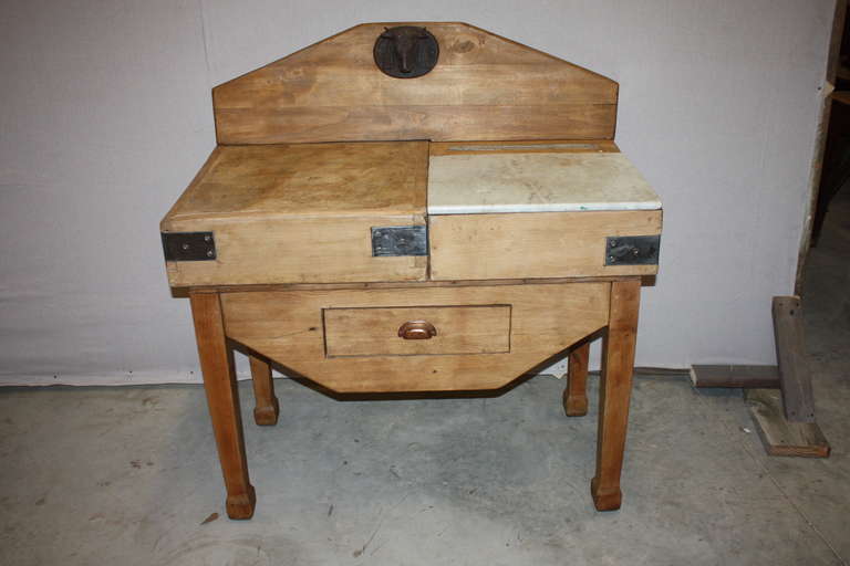 This is a very nice old butcher block I purchased in France.  It is interesting in that one half of the top is a marble cutting board and the other half is a wood chopping block.  The wood half shoes some wear, it is not completely level.  There is