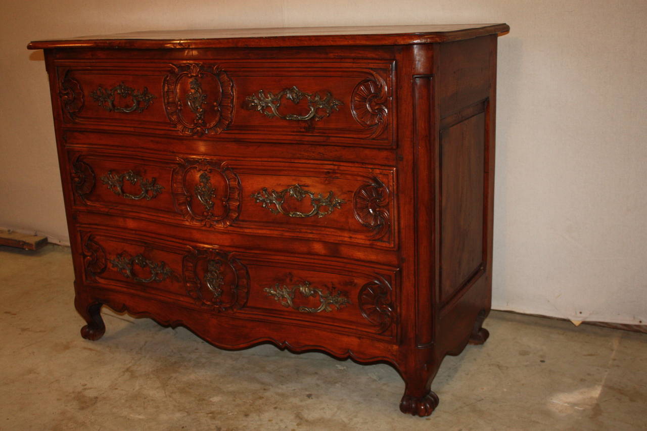 This is a beautiful French Walnut Commode dating to the mid 1800's. It is a very nice size.  French Commodes can at times be too large.  This commode is a very nice size in my eyes.  The grain of the walnut is very nice as is the overall patina and