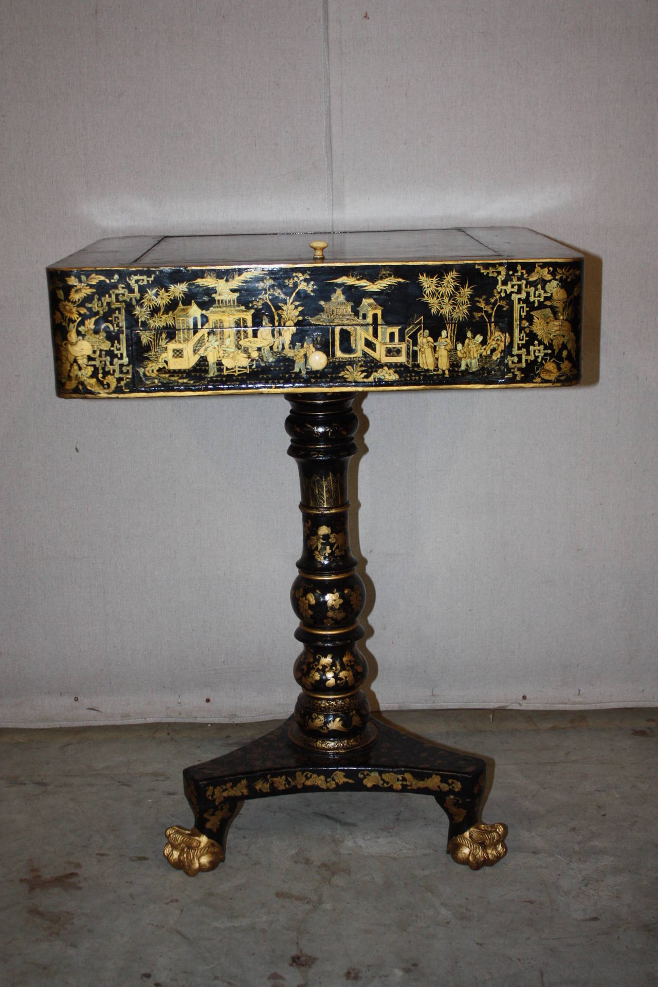 This is an absolutely stunning chinoiserie game table I purchased in England.  Every side is painted as is the leg  and the base.  The top lifts off to reveal a backgammon board.  The top can be flipped and placed back into its cradle to turn the