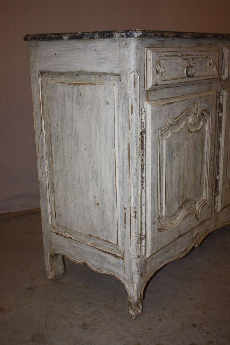 This is a very attractive painted French enfilade with a faux marble top.  It dates to the late 1800's.  It has a very nice patina.  The interior is one large open space with a shelf stretching the full length.