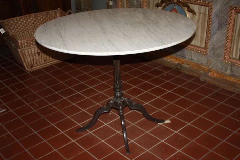This is a very beautiful large Italian bistro table dating back to the mid 1800's.  The Cast Iron base is very attractive.  this table could work in any setting from an outdoor dinning table to a side table.
