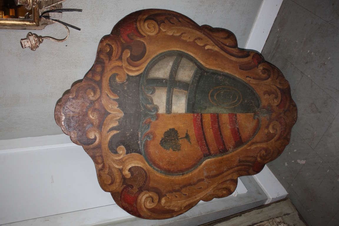 This Italian Plaque with painted crest is really magnificent. The crest is convex which is very unique.  The colors are rich.  The patina is very nice.