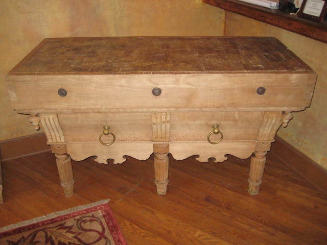 This is a very attractive butchers block, chopping block I purchased in France.  The top shows some wear but not so much that the top is uneven to the point that it is a problem.  There are two drawers under the block.  The base has a very