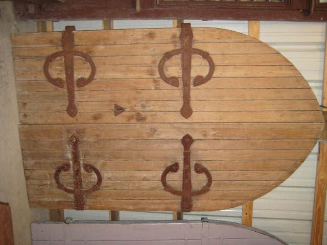 This is a really nice pair of English gothic arched doors that were purchased  in north England.  They are made of pine.  The hardware is exceptional.  Please visit our website to view our full inventory: www.crownandcolony.com