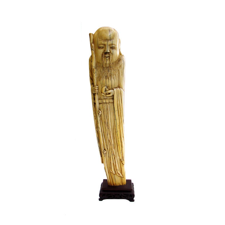 A LATE MING DYNASTY IVORY FIGURE OF AN IMMORTAL For Sale