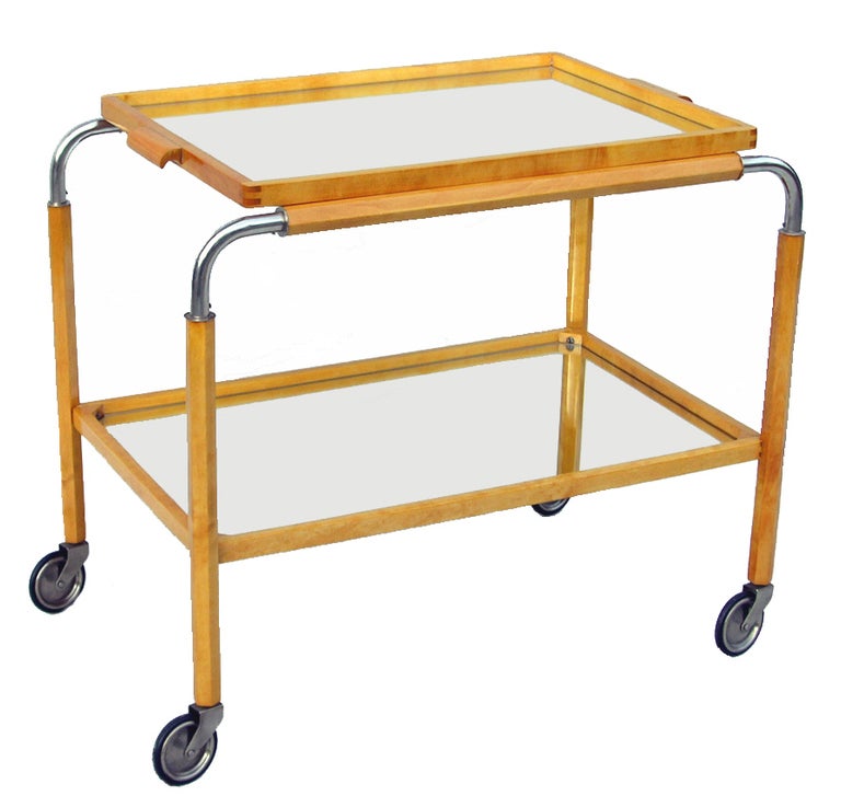 A Swedish Art Deco drinks trolley / cart with detachable mirror tray top on caster wheels.