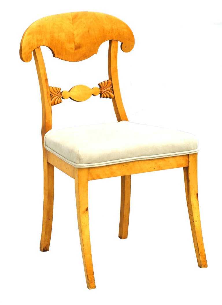 Chairs with curved shield backs and sabre legs