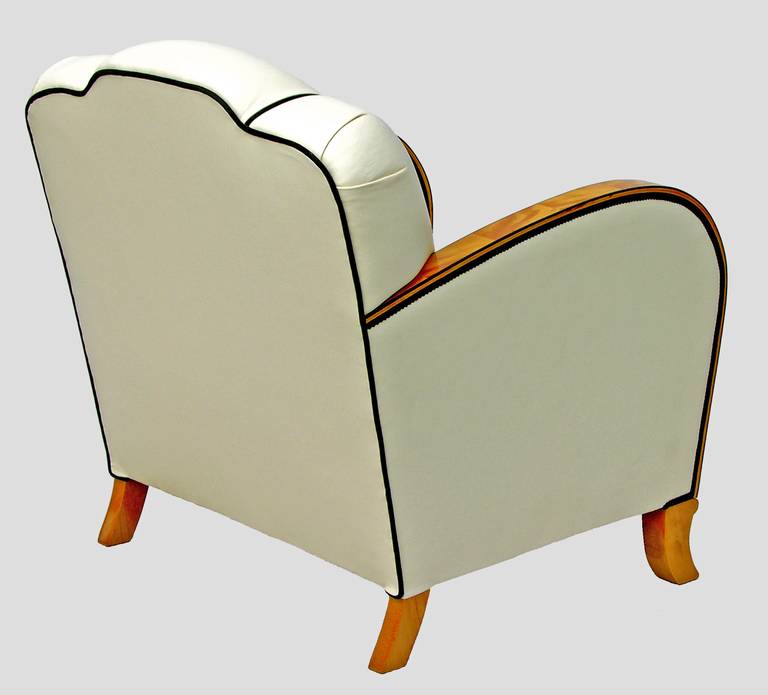 Comfortable armchair with a sprung seat with curving armrests