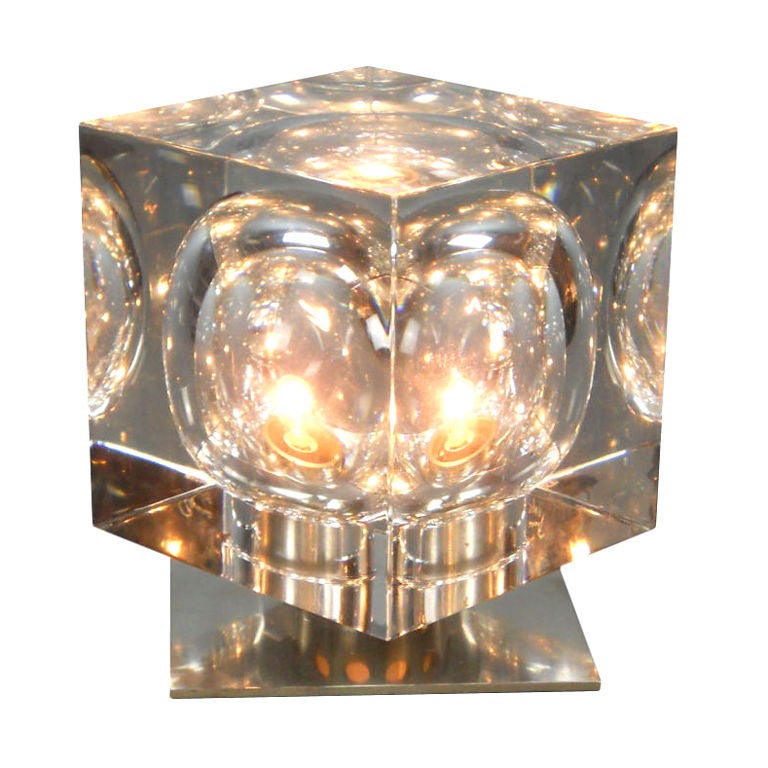 The solid cube with hollowed spherical interior swiveling on a pierced cylinder and square base. Inscribed Baccarat R. Rigot and stamped Baccarat, France.