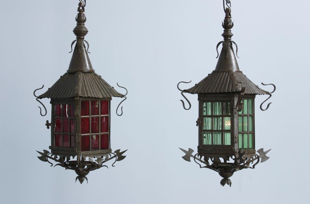 Each lantern has a fluted sloping pagoda roof ending in scrolls. The glass panels are fitted with mullions and opens on one side for ease in changing the light. They end with a pierced foliate finial and a standard on each corner.

Provenance: A