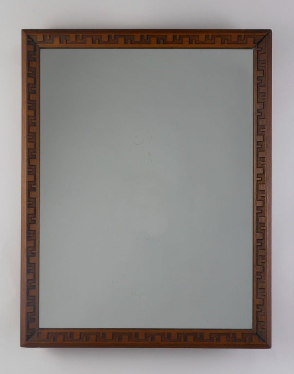 The Taliesin mirror frames have a carved geometric design border. They are fitted with original table stand or can be hung. Both are stamped on reverse: NO.2002.MIRROR.
