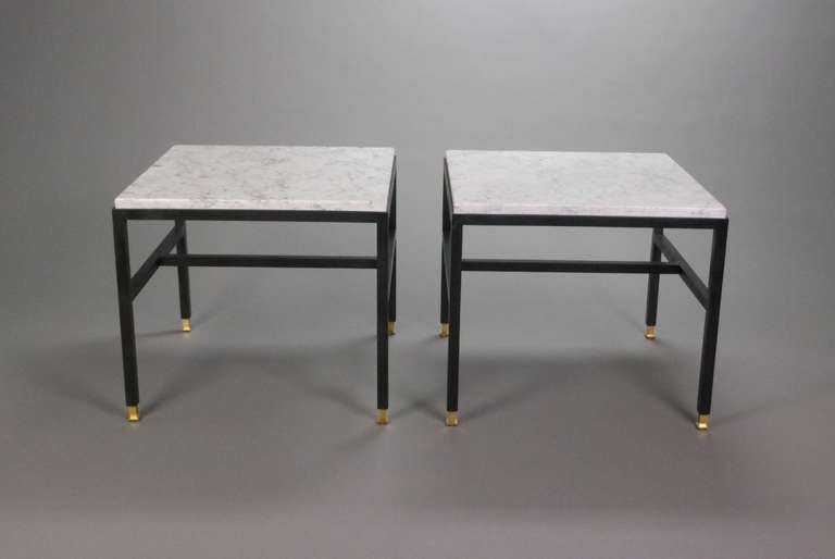 Each with a grey veined white marble top inset into the rectilinear frame on four legs joined by an H-form stretcher ending in brass feet.