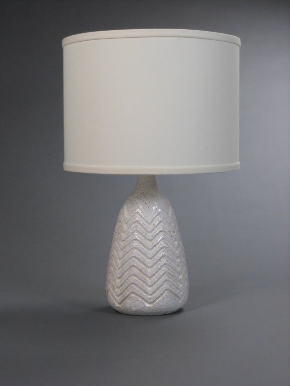 Of tapering ovoid form with chevron relief throughout.
Height to top of shade: 21