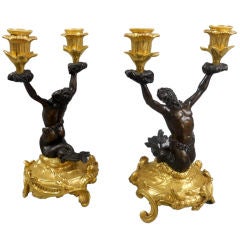 A Pair of Louis XV Gilt and Patinated Bronze Triton Candelabra