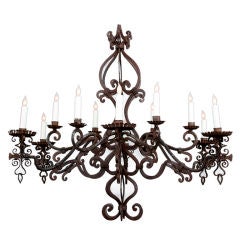 An Italian Wrought Iron 12 Light Chandelier