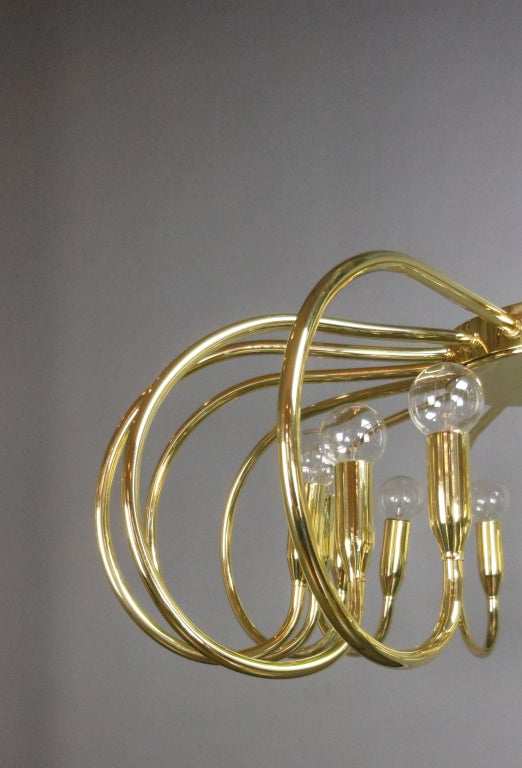A Mid-Century Modern Brass Sixteen-Light Chandelier For Sale 2