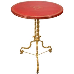 A French Gilt Iron and Red Leather Tilt Top Table