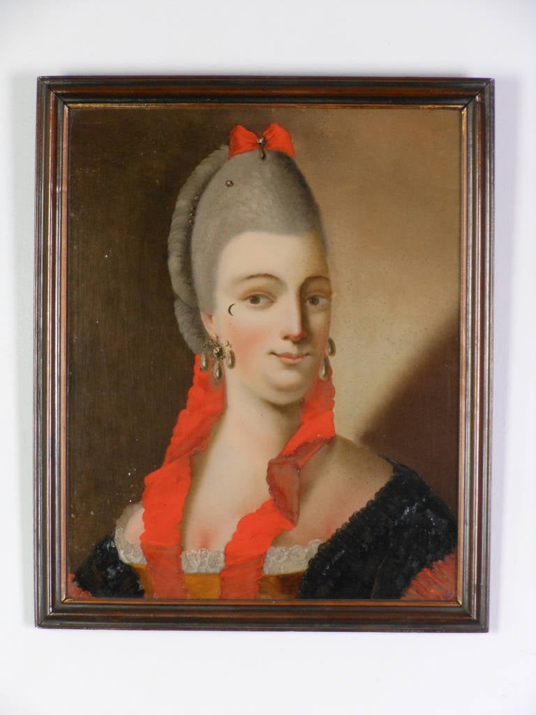 Painted in reverse on glass, this remarkable portrait, probably copied from a miniature, has retained its original color.

With inscription on back: 
Elisabeth Kiøge Født Lindkild (Limkilde) Malet I Brudedragt, circa 1782, Død 1796 i København