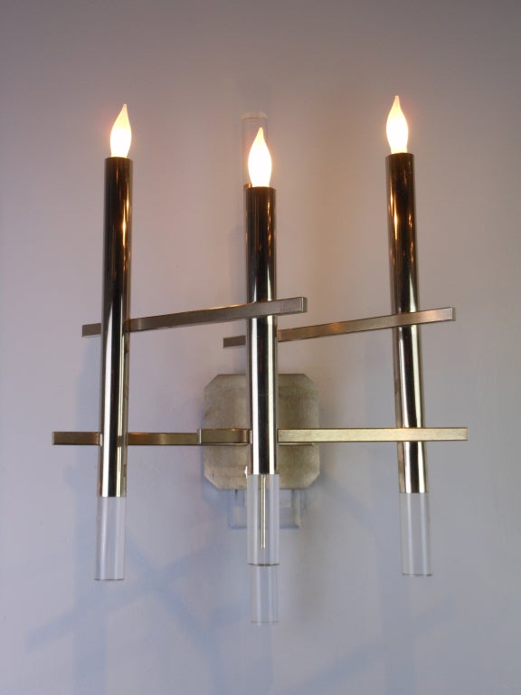 This elegant geometric pair of Mid-Century Modern wall lights have four chrome rods ending in Lucite and are connected by rectangular bars. 

Gaetano Sciolari (1927-1994), the Italian lighting designer, created sconces and chandeliers for
