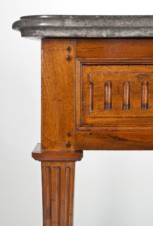 A Louis XVI Brass Mounted Walnut Console Table
