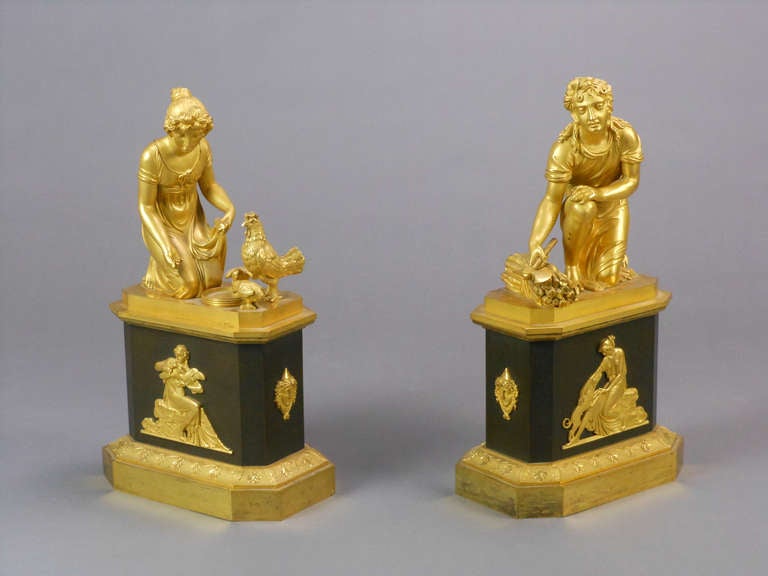 Each of these pastoral sculptures sits atop a stepped rectangular pedestal with canted corners, acanthus leaf frieze and a male classical mask on each end. One features a relief of Diana and a dog and is surmounted by a young man with an axe and a
